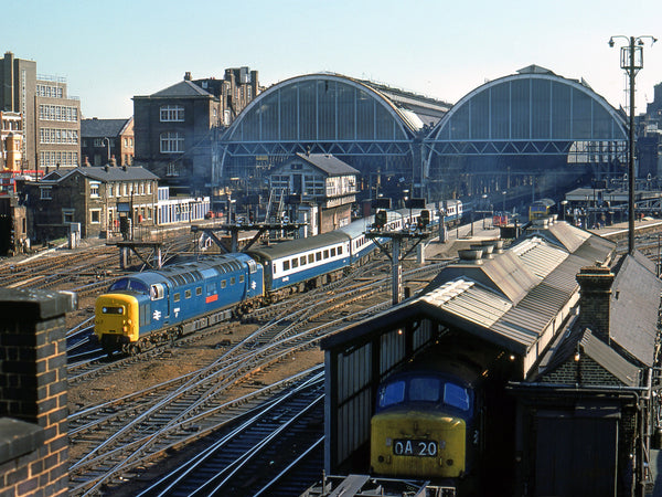 Colour elevated view of Class 55 Deltic 55014 departing King’s Cross with passenger coaches, crossing the station approaches beneath twin arched train sheds
