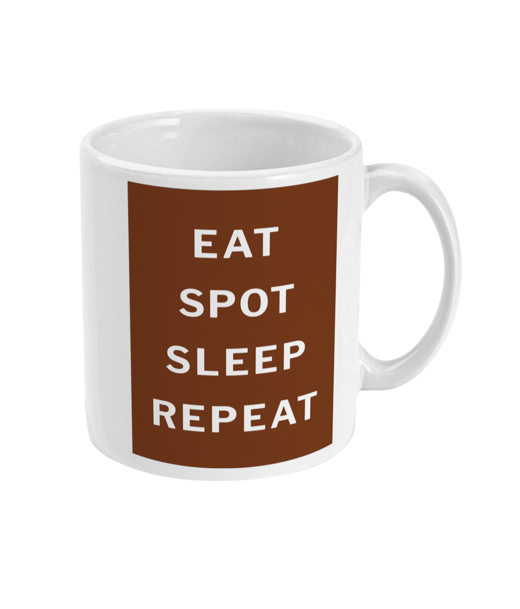 Side view of the Eat, Spot, Sleep, Repeat mug showing the maroon lettered panel